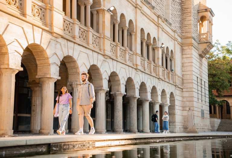 two students walking on campus