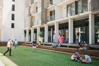 Group of students socialising outside Residential college. 