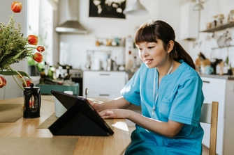 Mid-shot of an international health professions education student at home learning online.