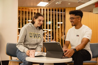 Students studying inside Reid Library.