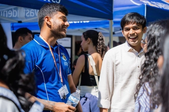 UWA representative talking to students at Careers Fair. 