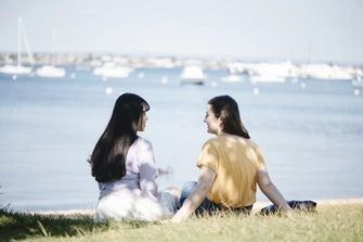 Two students in conversation, viewed from behind