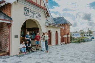 Group of students socialising outside the UWA Albany Centre building, daytime